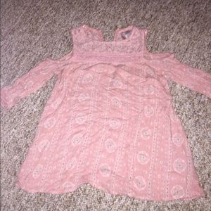 A pink off the shoulder top